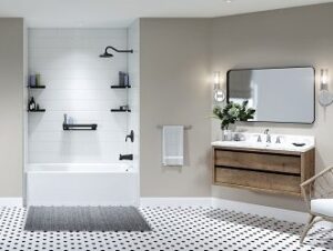 Modern bathroom with white tub, black fixtures, and floating vanity with large mirror