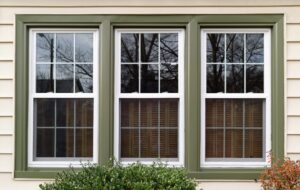 Close up of sparkling new windows with attractive green trim