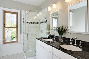 Gorgeously styled bathroom with a walk-in shower and subway tiled walls.